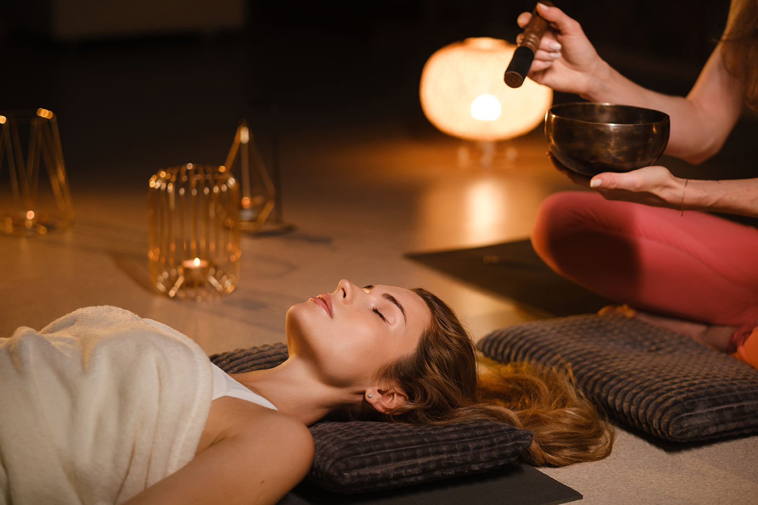 a-girl-lying-on-the-floor-relaxes-to-the-sounds-of-4ADRT74.jpg